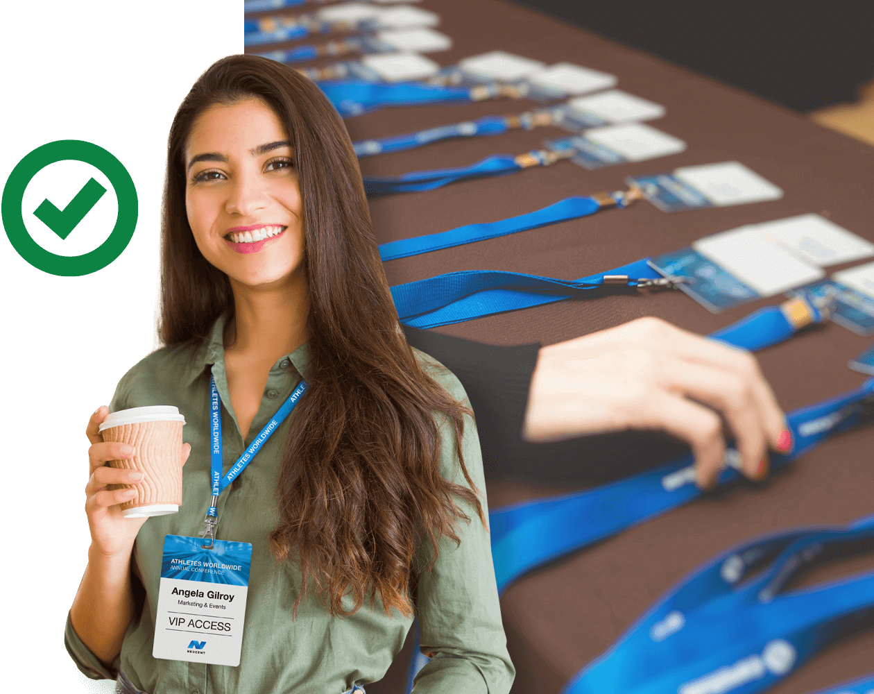 Table of Event Badges with Smiling Woman wearing a badge and holding a cup of coffee